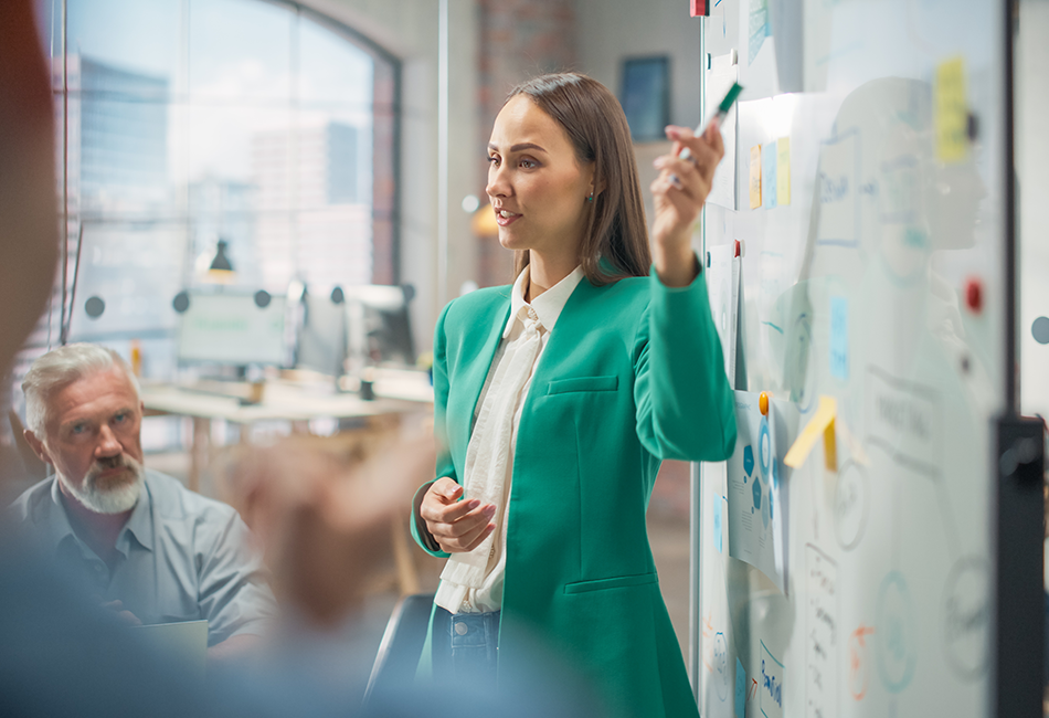 Female CEO using a whiteboard