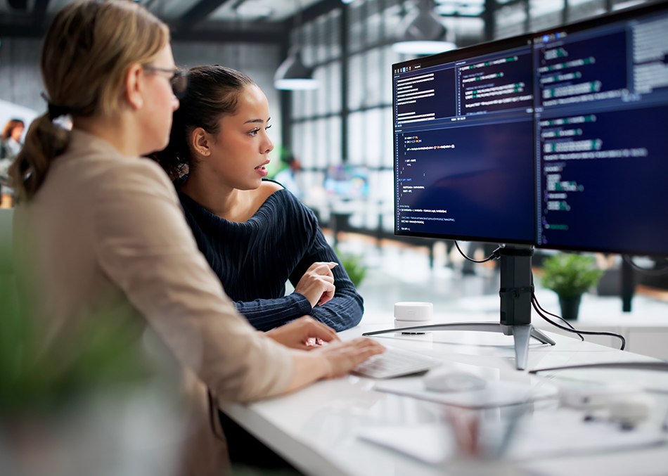 950x677 - two women at a computer