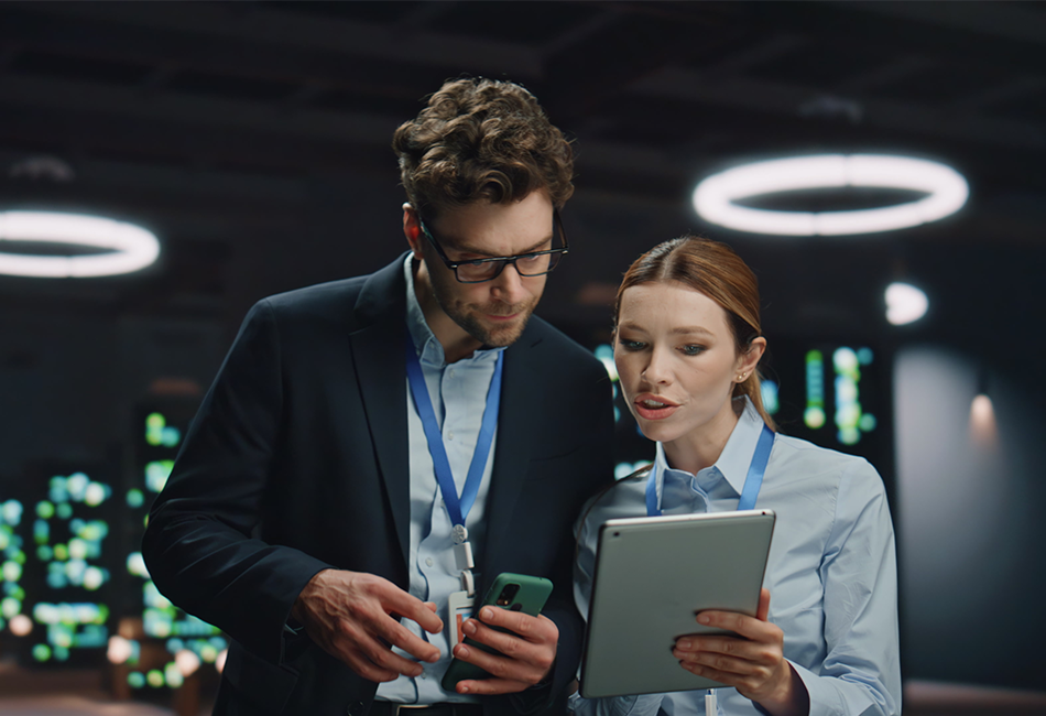 950x650 - Two people looking an iPad