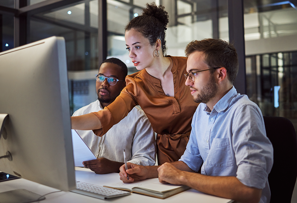 People discussing information on a computer